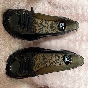 Fly London black patent leather wedge shoes never been worn. 38 EU/ 7 1/2 US.